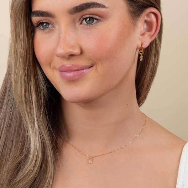 Model Wears Blair Medium Plain Hoops Lab Grown Diamond Lou Pink Emerald Earring Charm Bezel Yellow Gold Pendant Cropped