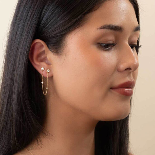 Model Wears Elara Bezel Diamond Chain Earring Enhancer With Anna 0.10Ct Anna 0.16Ct Yellow Gold Studs Cropped