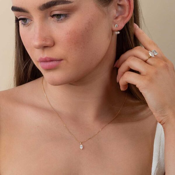 Model Wears Diamond Anna Studs Luna Marquise Bezel Earring Enhancer Lou Marquise Medium Bezel Charm Yellow Gold Cropped