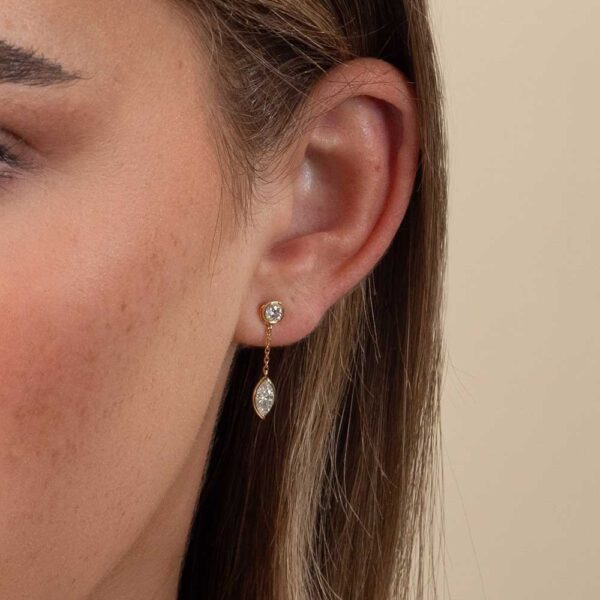 Model Wears Diamond Bezel Marquise Drop Jen Earring Enhancer With Yellow Gold Anna Stud Earrings Cropped