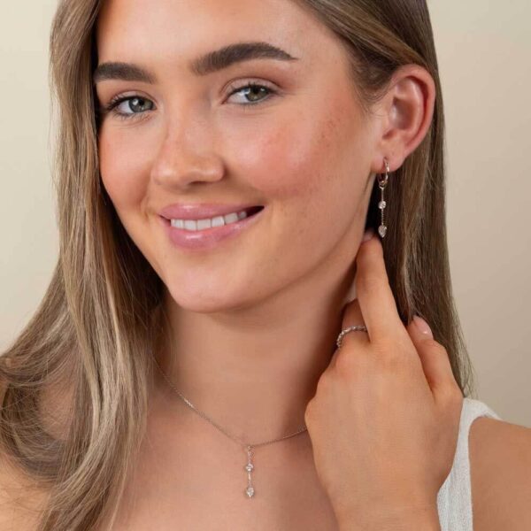 Model Wears Lab Grown Diamond Joanna Pear Bezel Drop Enhancer Two Stone Pendant With Blair Large Hoops White Gold