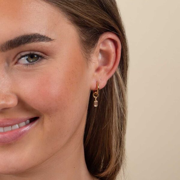 Model Wears Lab Grown Diamond Bezel Lou Pink Emerald Earring Charm With Blair Medium Hoops Yellow Gold Cropped