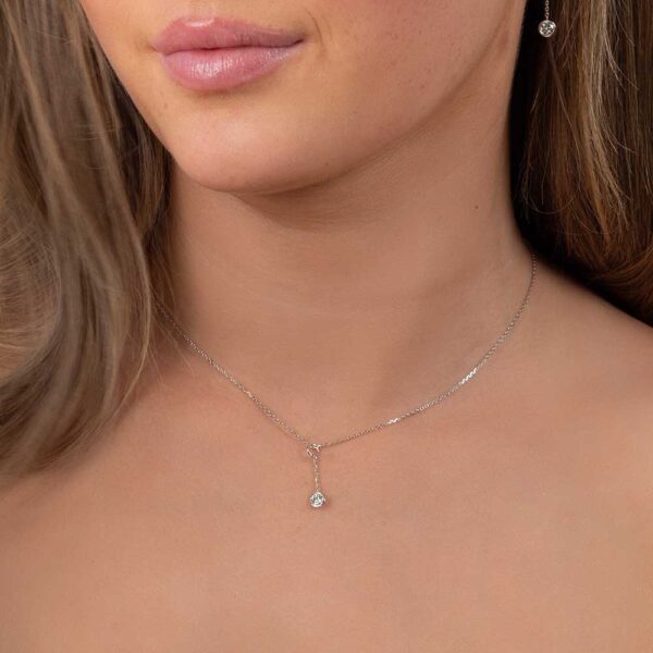 Model Wears White Gold Jen Round Medium Bezel Drop Enhancer Diamond Pendant Cropped