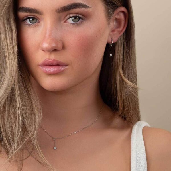 Model Wears White Gold Jen Round Small Bezel Enhancer Diamond Drop Pendant Hope Small Ball Plain Hoop Earrings Cropped