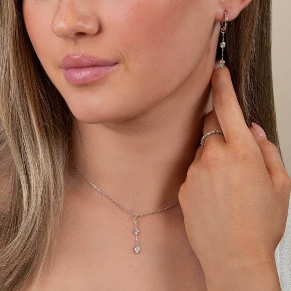 Model Wears White Gold Joanna Pear Bezel Two Stone Drop Diamond Pendant Enhancer With Blair Large Hoops Cropped