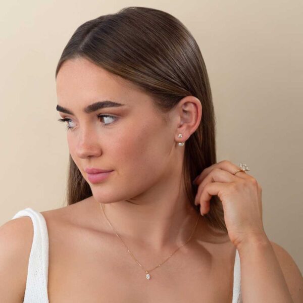 Model Wears Yellow Gold Anna Bezel Earrings Luna Marquise Earring Enhancer Lou Marquise Medium Bezel Diamond Pendant