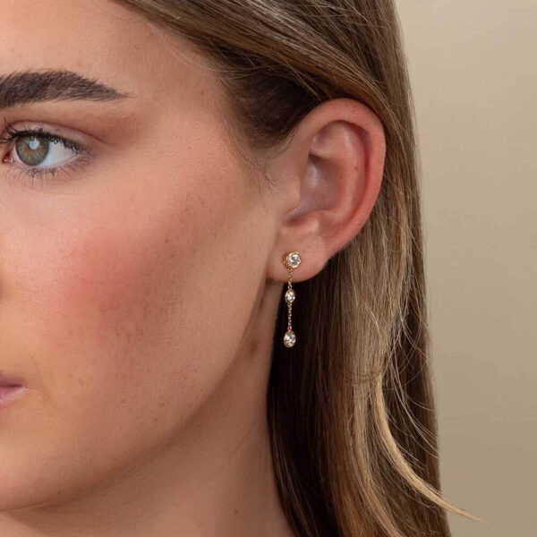 Model Wears Yellow Gold Joanna Round Small Bezel Drop Earring Enhancer With Anna Diamond Stud Earrings Cropped