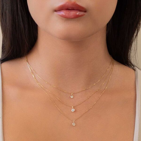 Model Wears Yellow Gold Lou Round Small Medium Large Bezel Charm Layered Diamond Pendants Cropped