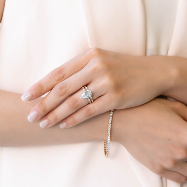 Model Wears Josefa Evie Yellow Gold Lab Grown Diamond Pear Under Rail Alternating Marquise Round Band Ring